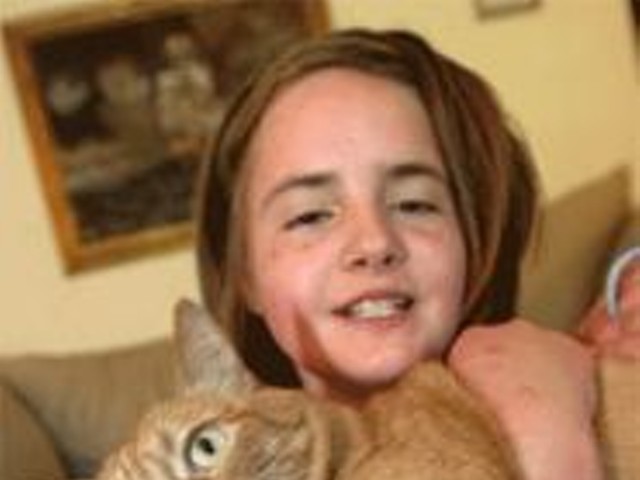 Eleven-year-old Anastasia McGrath loves her easygoing cat, Tiger.