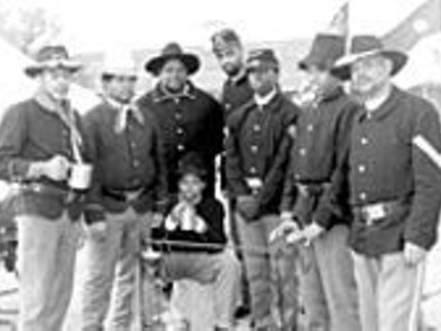 The Buffalo Soldiers enjoy cups of coffee while waiting 
    for the Buffalo Gals to come out tonight.