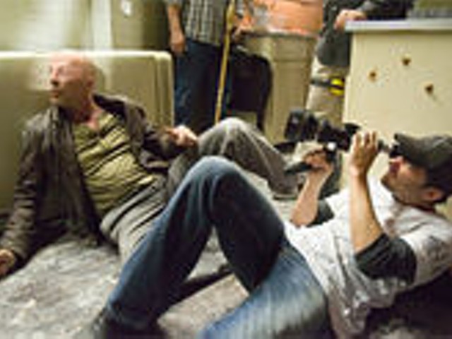Director Len Wiseman frames Bruce Willis in Live Free or Die Hard.