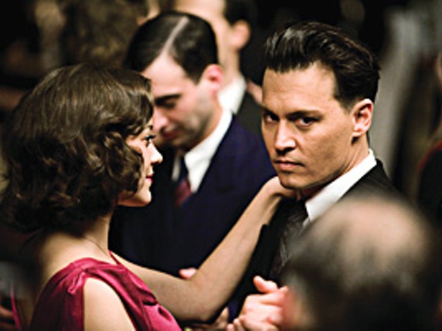 On target: John Dillinger (Johnny Depp) romances Billie Frechette (Marion Cotillard) between robbing banks.