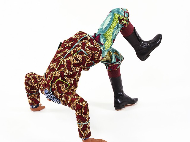 Yinka Shonibare MBE, b. United Kingdom, 1962; Boy Doing Headstand, 2009; life-size fiberglass mannequin, Dutch wax-printed cotton, mixed media; 27 1/2 x 33 x 30 1/2 inches; Courtesy of the artist and James Cohan Gallery, New York.