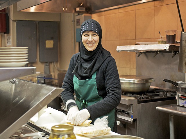 Roudayna Mohsen prepares a sandwich in the kitchen of the Vine.