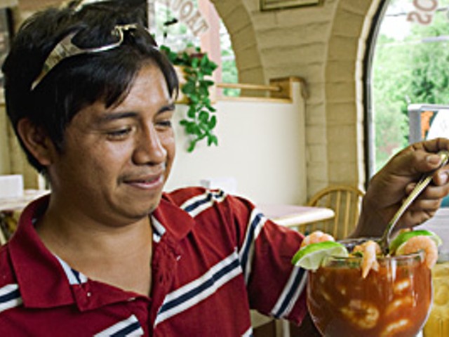 Marvin Hernandez enjoys a shrimp cocktail at Taqueria la Pasadita in Overland.