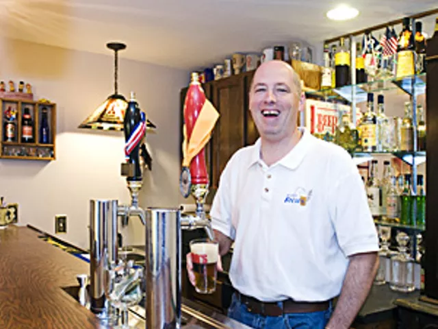 St. Louis Brews member Bob Beckmann pours a glass of his homebrew.