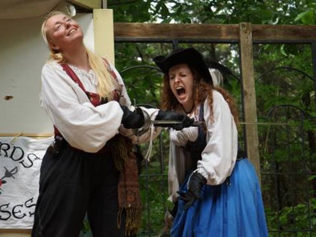 Maria Romine, playing the pirate Angelique LeFleur, "stabs" St. Louis actress Beth Ashby during a Swords and Roses show.