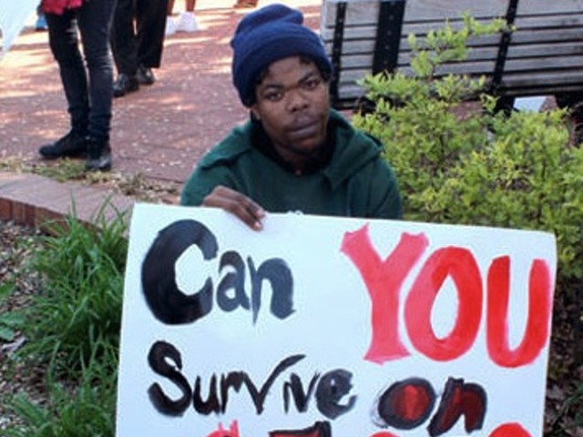 A St. Louis worker protests the minimum wage.