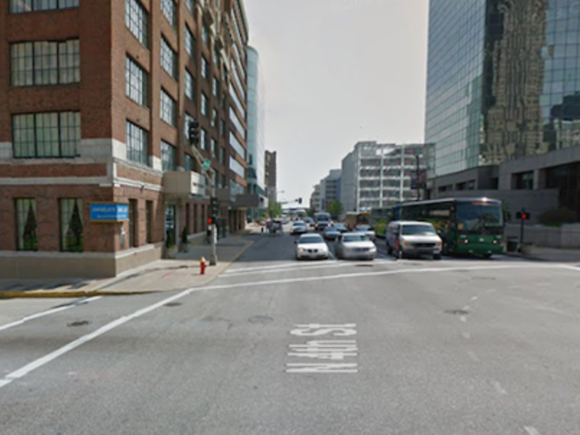 The shooting occurred around 2:35 p.m. in front of the Drury Plaza Hotel (left) at Fourth and Market.