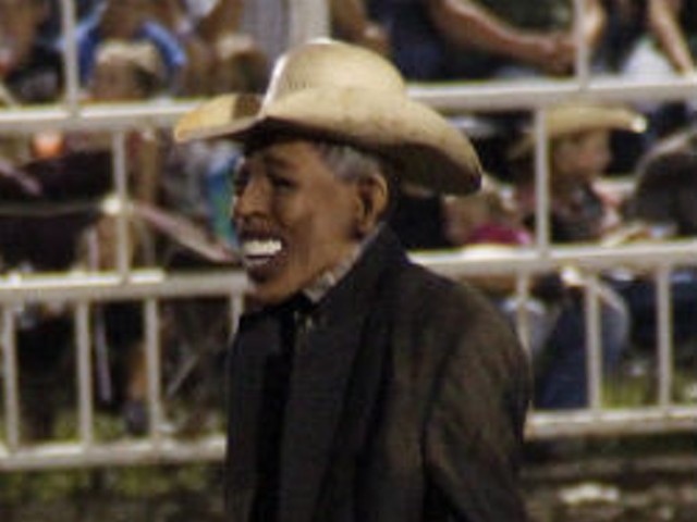 Rodeo clown with Obama mask.