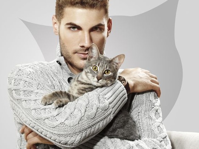 Eric Peters, a model with West Model Management, snuggles up with Curly, a Tenth Life rescue kitty with feline immunodeficiency virus.