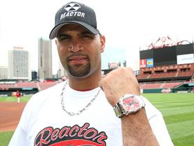 In this advertisement photo, Pujols shows off his healthy left forearm.