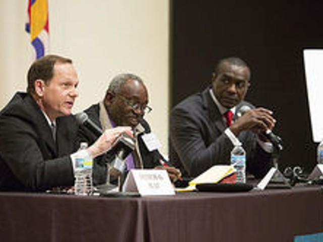 Slay and Reed (far right) tangle at a mayoral debate over Veolia.