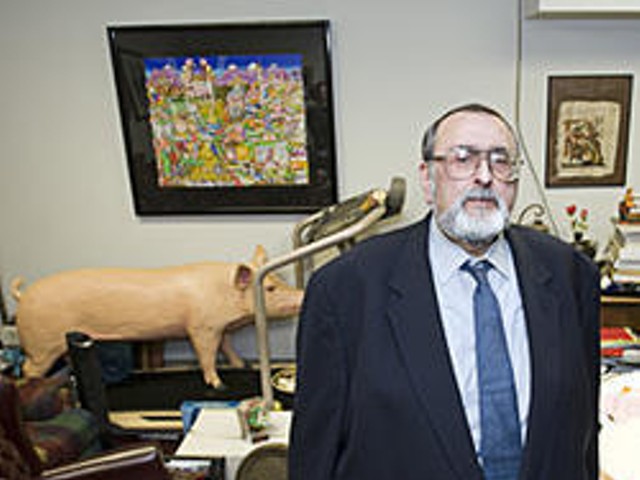 Anzalone posing last year in his cluttered Clayton law office.