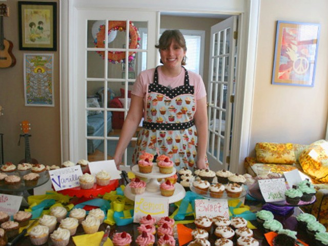 Kaylen Wissinger with a sampling of Farm Fresh Cupcakes in her south-city home.