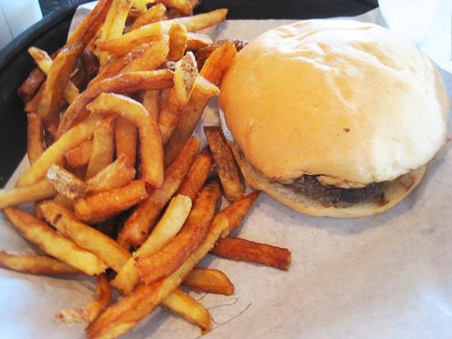 A burger with fries at Dave & Tony's Premium Burger Joint