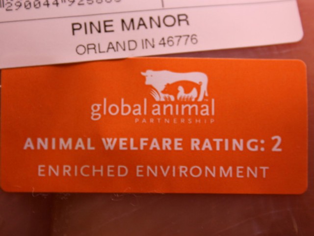 Close-up of a step-rating label on a package of Whole Foods chicken.