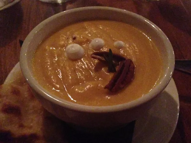 Butternut squash soup with toasted pecans and sour cream. | Nancy Stiles