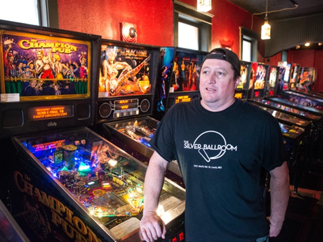 Doc, with some of the bar's pinball machines.