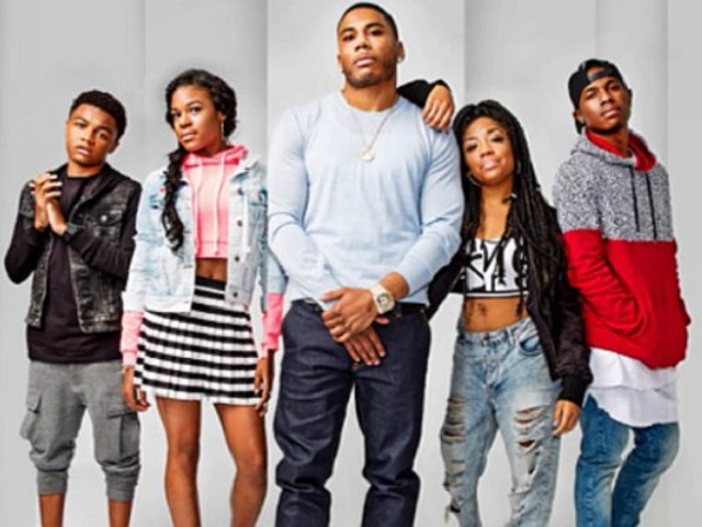 Nelly, with the cast of his upcoming show, a.k.a. his family.