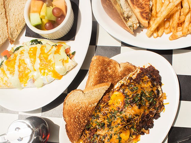 An array of Kingside's food, including a spinach omelet, grilled chicken Cuban sandwich, the "Kingside Slider," waffled French toast and kale salad.