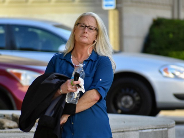 Ex-St. Louis police officer Lori Wozniak leaves court on Tuesday.