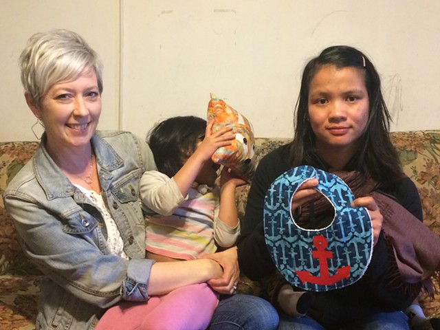 FORAI Executive Director Jennifer Owens (left) and artisan Ning Lam Lun (right) show off some of Lun's creations.