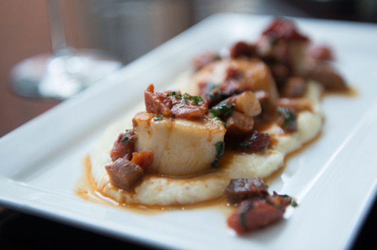 Robust's scallops come atop cheesy grits and are topped with ham and sun-dried tomatoes. Slideshow: Inside Robust on Washington Avenue.