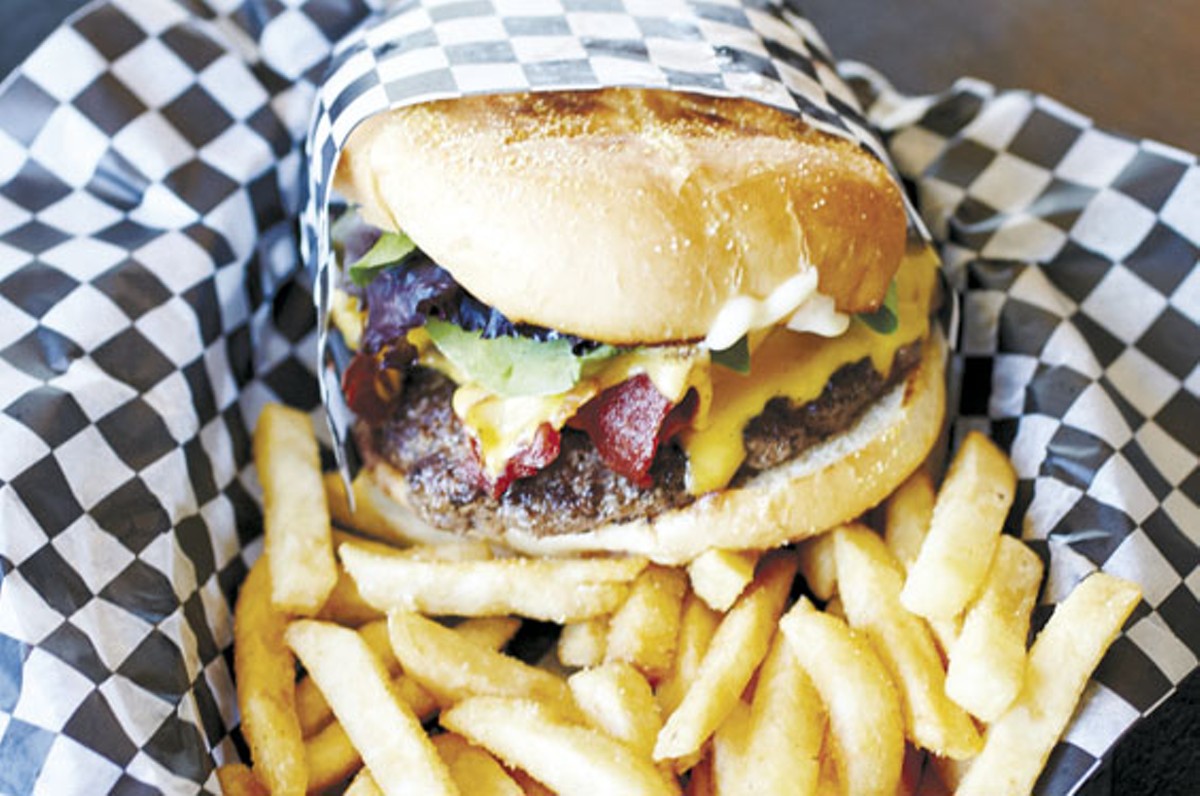 "The Porkinator" is piled with six pieces of bacon, two slices of American cheese and spring greens on a kaiser roll.
    
    
    See photos: The Tattooed Dog Serves Delicious Burgers and More in Wentzville
