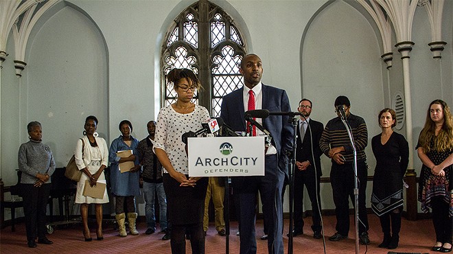 Nicole Nelson and Blake Strode of ArchCity Defenders speak at a press conference announcing a new class-action lawsuit against the city of St. Louis.
