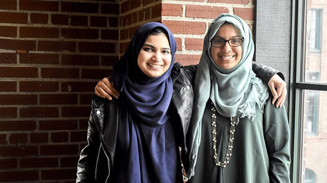 Yusra Ali (left) is the curator for the second annual Muslim Art Exhibit. Her younger sister Sadia (right) is helping her sister plan the event.