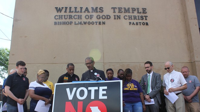 Rev. Gray began the rally in front of Williams Temple
 with a prayer.