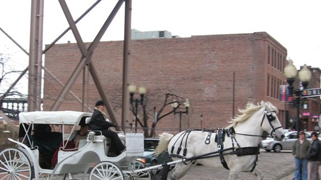 A horse-drawn carriage operates in Laclede's Landing.