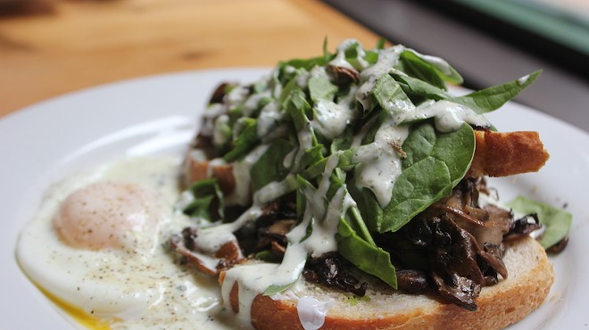 The "Artisan Toast" is topped with avocado, mushrooms and spinach, with an egg on the side.
