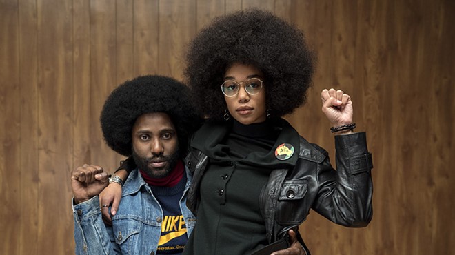 Ron Stallworth (John David Washington) pretends to be a KKK fan while also courting Black Power activist Patrice (Laura Harrier).