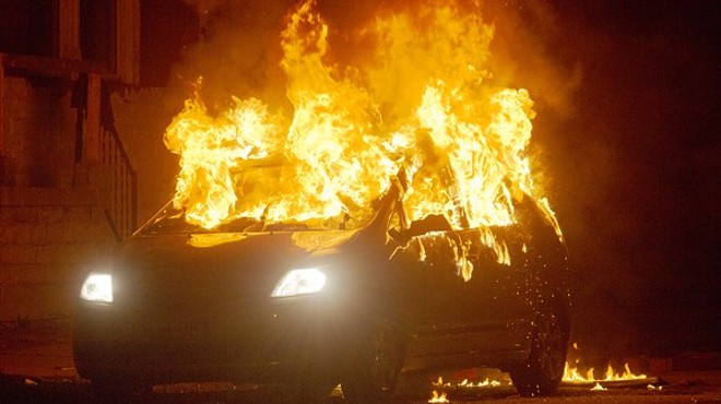 Neighbors lit a car on fire at Page and Walton in August 2015 to protest the police shooting of Mansur Ball-Bey.