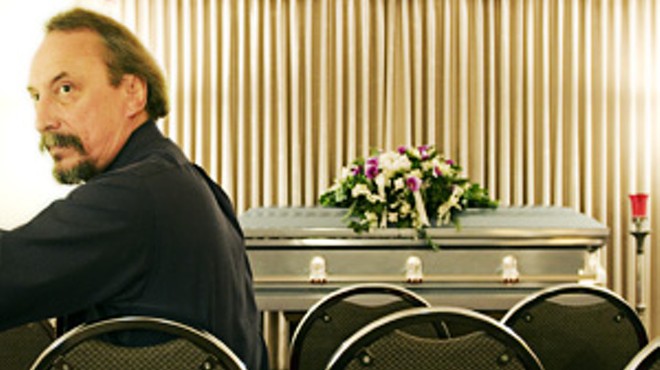 Jeff Palmore in the chapel of Bell Funeral Home. The casket is empty.