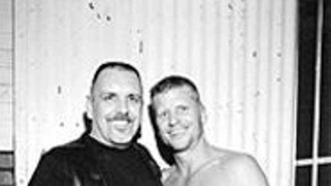 Newly tanned Mr. Missouri Leather Ron Walters (right) 
    hopes outgoing champ Mark Bozif keeps that lighted 
    stogie away from the ol' rawhide.