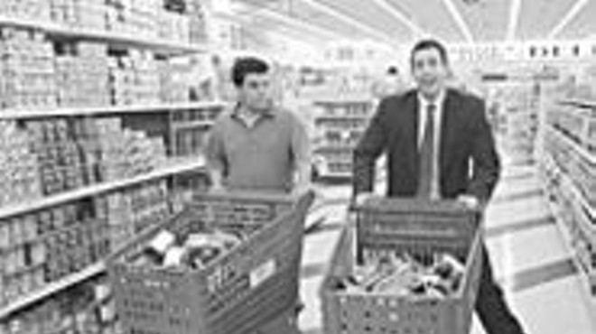 Luis Guzm&aacute;n and Adam Sandler in Punch-Drunk 
    Love, a strange and amazing piece of work