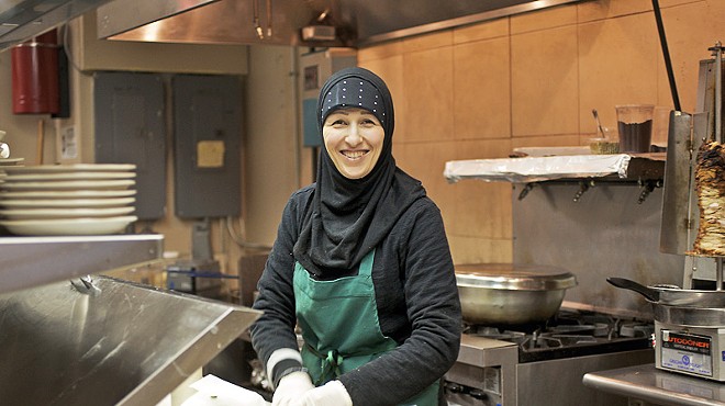 Roudayna Mohsen prepares a sandwich in the kitchen of the Vine.