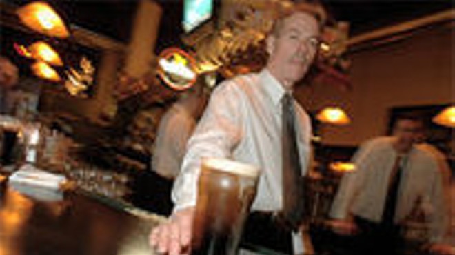 Guinness is good for you: Donovan Buechel serves a perfect 
    pint.