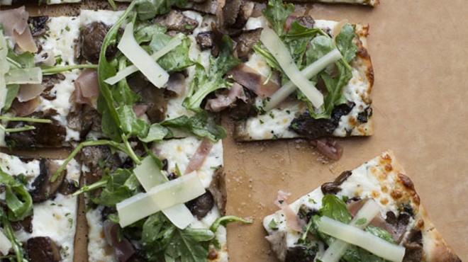 Billy G's "Farmhouse White" pizza is made with roasted garlic-herb oil, mozzarella and wild mushrooms, then finished with prosciutto, shaved parmesan and arugula. Photos: Billy G's Italian American Restaurant in Kirkwood