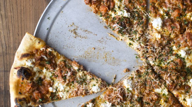 The "Bolo" is a New York-style pizza, topped with extra-virgin olive oil, herbs, mozzarella, ricotta, savory pork and beef bolognese, freshly grated Parmesan and parsley.
    
    
    See photos: Blind Tiger Dishes Divine Pizza in Maplewood