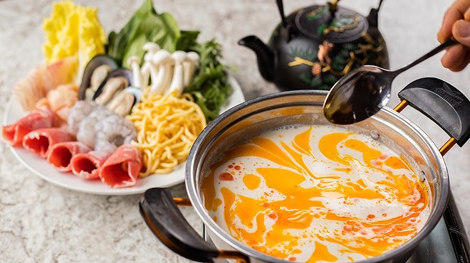 The "Thai Tom Kha Hot Pot: includes veggies, chicken, shrimp, white fish, green mussels and noodles.