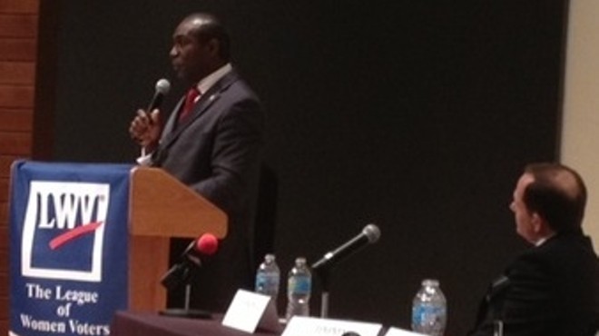 Mayor Francis Slay watches Lewis Reed at a recent debate.