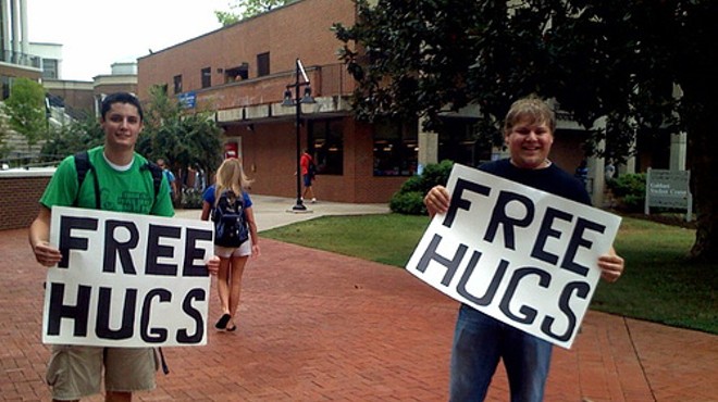 Cops are on the look-out for a man embroiled in a more conniving form of the Free Hugs campaign.