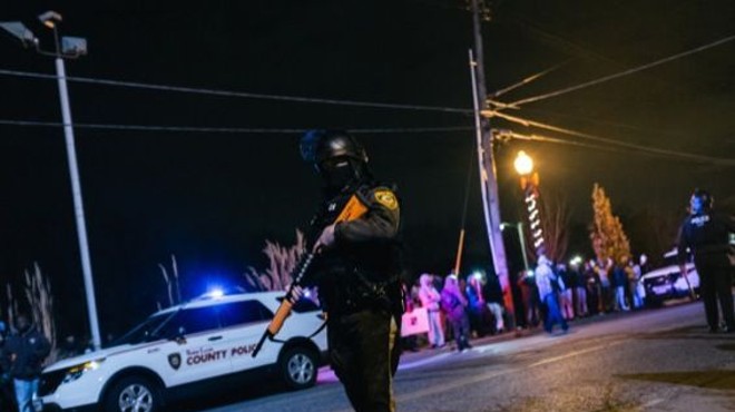 A police officer patrols Ferguson protests. Check out more photos from Ferguson in our RFT slideshow.