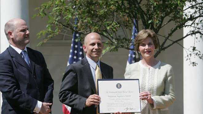 John Steffen (left) and fellow St. Louis developer Craig Heller receive a preservation award from Laura Bush in May 2007.
