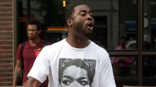 Corey Black, a St. Louis poet, throws down verses during a memorial to Maya Angelou Wednesday afternoon.