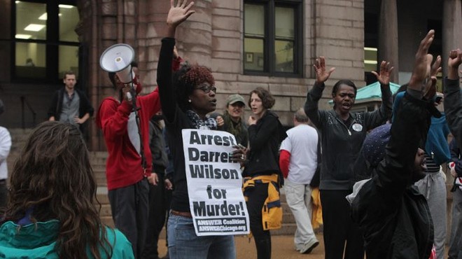 A protester outside St. Louis City Hall says she wants Darren Wilson indicted. But where is he?