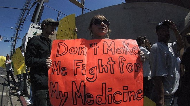 Activists protest DEA raids on medical marijuana facilities in California.