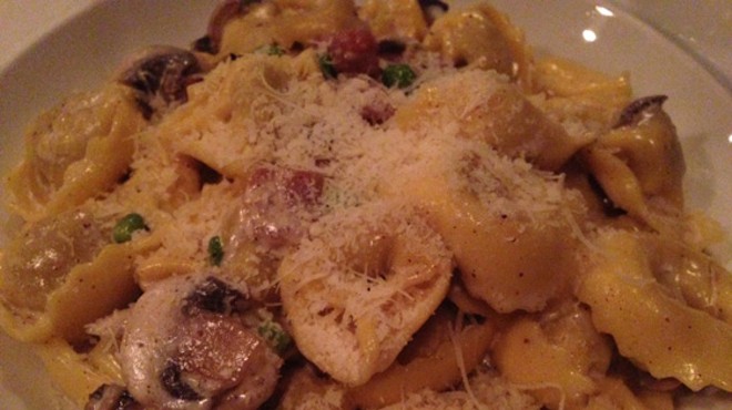 Meat-filled tortellini in a light cream sauce, mushrooms and peas, seasoned with prosciutto. | Nancy Stiles